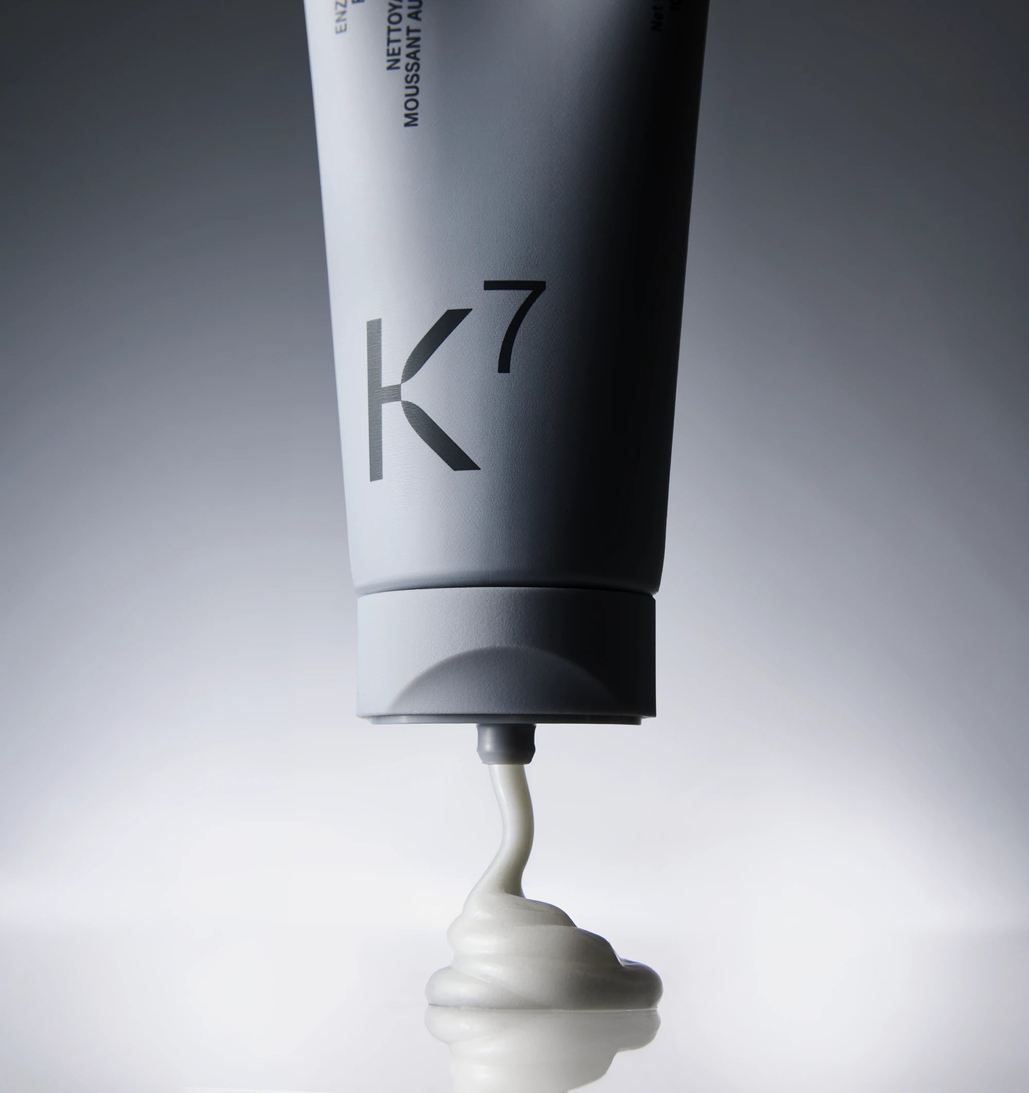 Enzyme face wash cream squeezed from the tube before lathering
